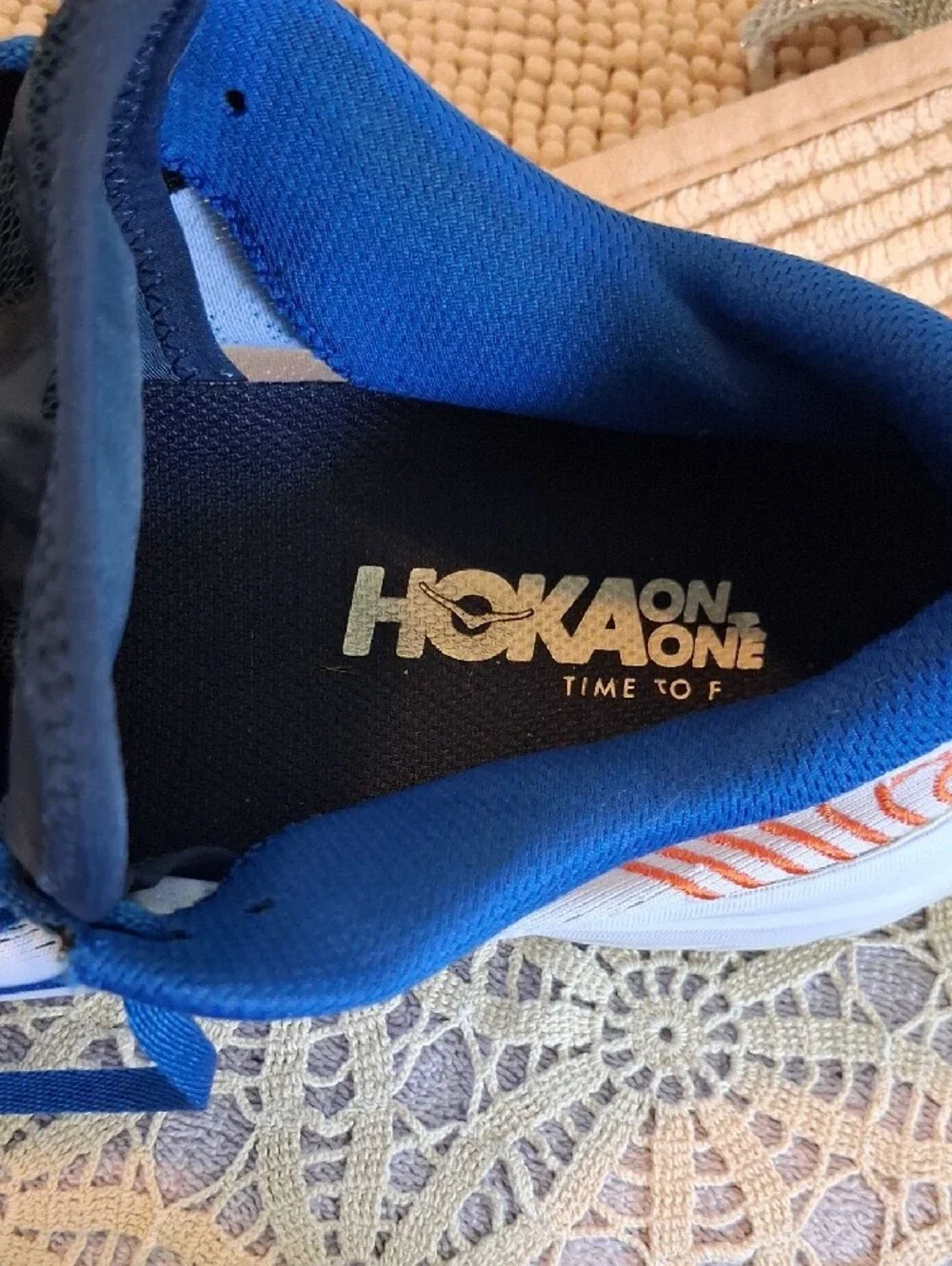 Hoka Blue and White Men's Running Shoes with Orange Accents